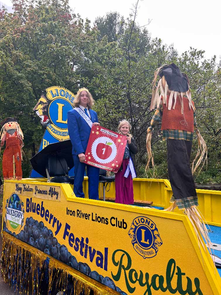 The Iron River Lions Club float won 1st Place at the Bayfield Apple Festival parade. Riding on the float is King Tristan Phillips and Princess Abby Ronchi. Congratulations!